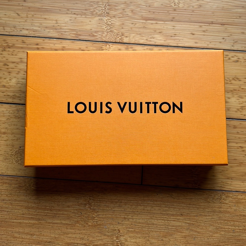 Orange Box with Brown Writing